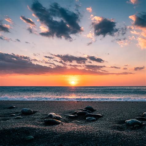 Sea Stones Shore Horizon Sunset Sky Hd Phone Wallpaper Peakpx