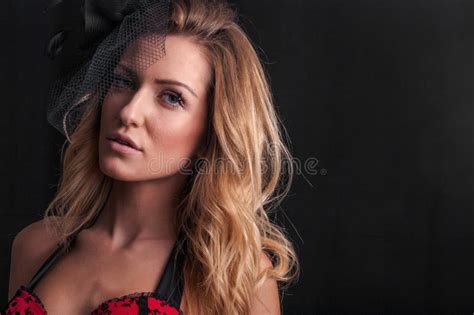 Close Up Portrait Of Beautiful Blonde Woman In Red Lingerie Posing On Black Background Stock
