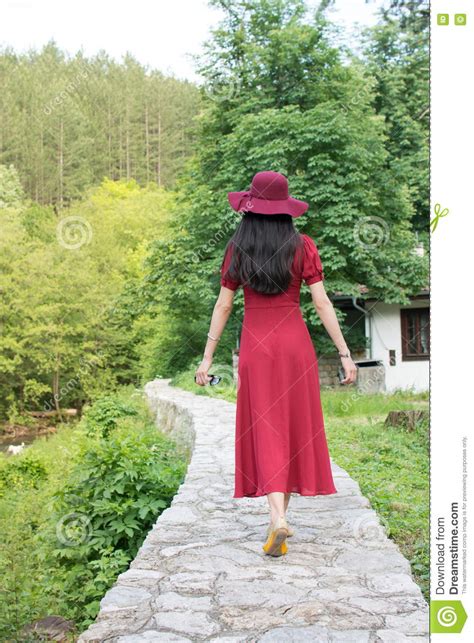 Woman Walking The Path Wearing Red Dress Stock Image Image Of Back