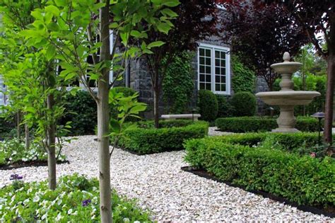 By donna mcglasson from gardens & chickens & worms, oh my! Crushed oyster shell path with carpinus and boxwood ...