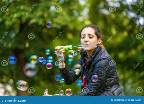 Young Woman Blowing Bubbles Stock Photo Image Of Adult Model 72208196