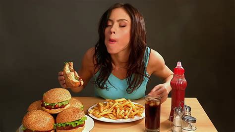 If you're worried about developing diabetes, cutting back on the fast food can help. Woman Eating Fast Food.Time Lapse Stock Footage Video ...
