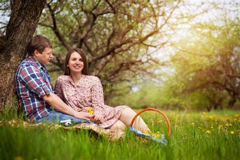 Happy Loving Couple On A Spring Meadow Stock Photo Image Of Tree