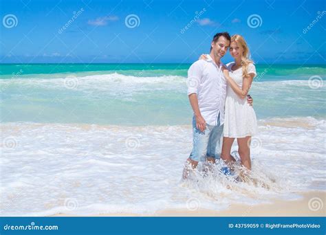 Cheerful Couple Embracing And Posing On The Beach On A Sunny Day Stock Image Image Of Holiday