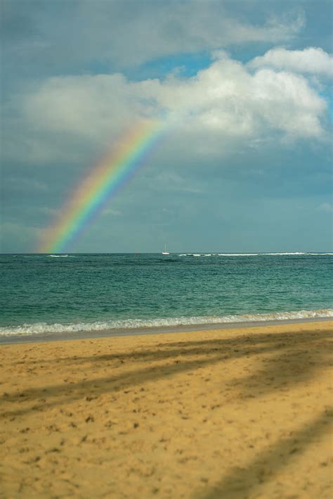 View Of Rainbow Over Pacific Ocean From The Beach In Hawaii Photograph