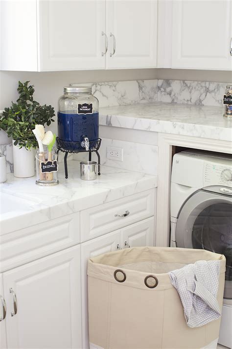 Finish cleaning your laundry room with a classic: Pottery Barn Laundry Room Organization Makeover