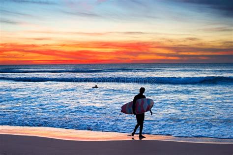 Surfer At Sunset Stock Photo Image Of Strolling Silhouette 65986780