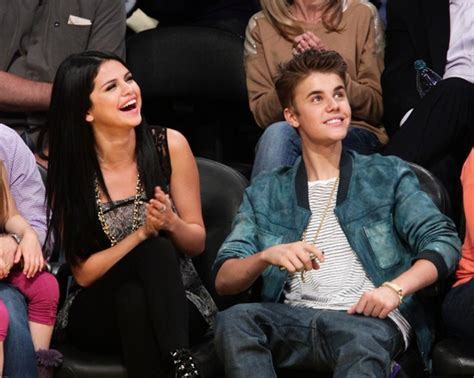 justin bieber and selena gomez spotted kissing at lakers game [photos]