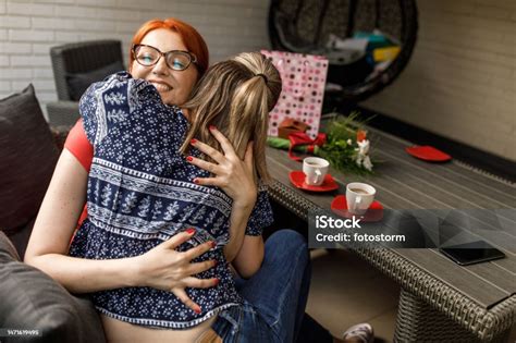 Mother And Daughter Having Bonding Moments And Hugging Each Other Stock