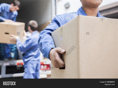 Movers Unloading Image And Photo Free Trial Bigstock
