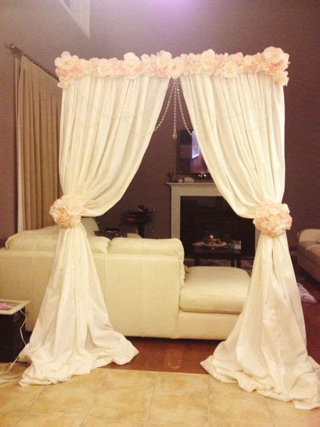 The wizards at a new leaf used the sketch to create nine floral garlands made of marigolds, bittersweet and dried oak leaves hanging from brown silk ribbon. Altar arch made with backdrop stand, cheap fabric, and ...