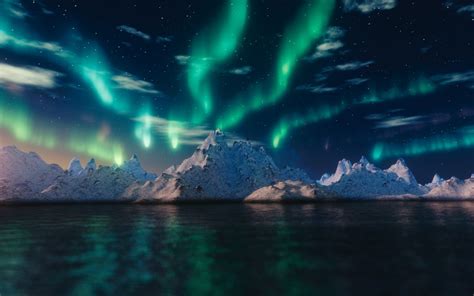Northern Lights Over Snowy Mountains Hd Wallpaper