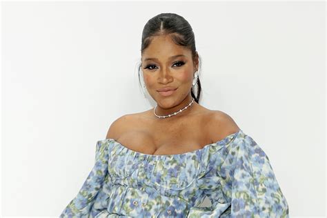 Pregnant Keke Palmer Flatters Her Baby Bump in Wild Swimsuit & Crocs