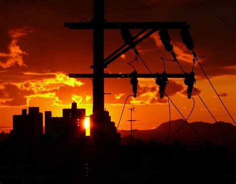 Wallpaper Sunset Sky Orange Sun Mountains Clouds Buildings