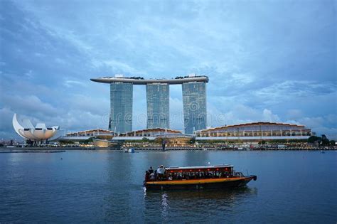 Tourist Boat On The Marina Bay With Famous Marina Bay Sands Building