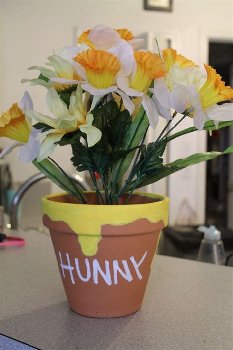 Go with classic pooh, using yellow, red and brown as your color palette, or you can adapt it to the gender of your baby by choosing a rustic, country theme or something modern! Honey Pot Centerpiece by FritterFinds on Etsy, $15.00 ...