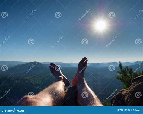 Naked Male Hairy Legs Take Rest On Peak Outdoor Activities In Summer
