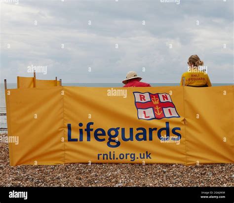 Rnli Lifeguards And Logo Seen On The Beach Stock Photo Alamy