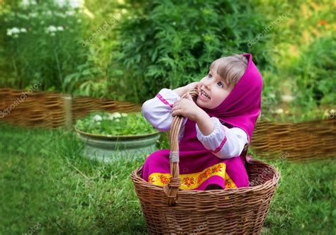 The Girl In The Costume Of Masha Village In The Wicker Basket Stock