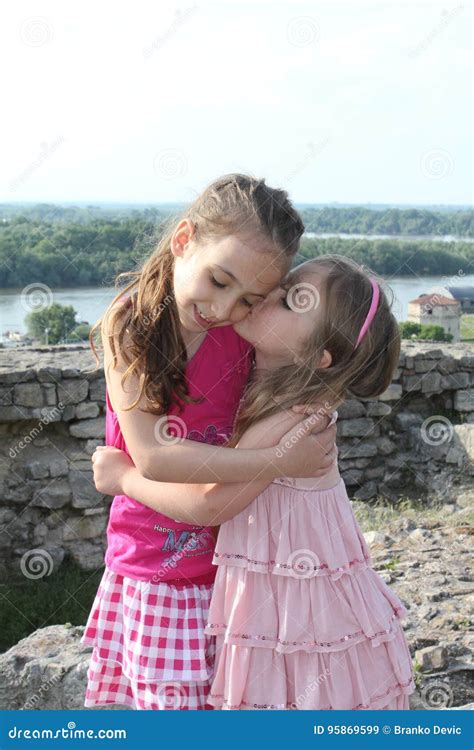 Beautiful Little Sisters Are Kissing Stock Image Image Of Beauty