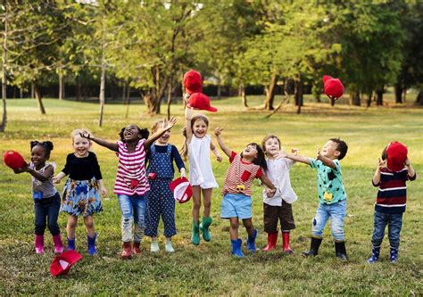 Group Of Diverse Kids Playing At The Field Together Royalty Free