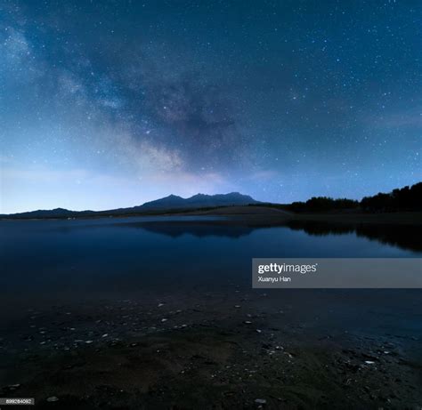 Night Sky Mountain Lake And Milky Way Galaxy High Res Stock Photo