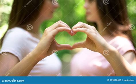 two lesbians making heart with hands free expression of love lgbt rights stock image image