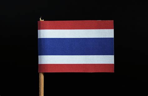 The National Flag Of The Kingdom Of Thailand On Toothpick On Black