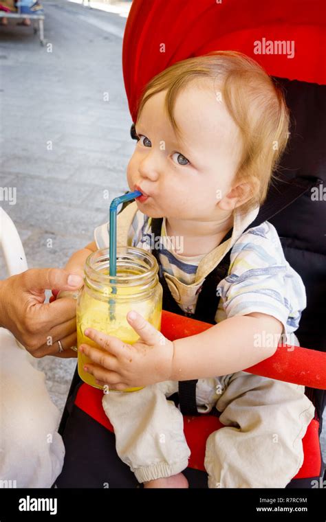 Portrait Of Baby Boy Drinking Juice Stock Photo Alamy