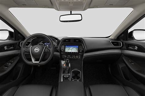 The Interior Of A Car With Beige Leather And Black Trims Including