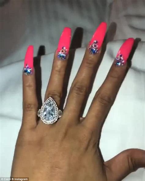 Cardi b has long stiletto embellished nails in youtube music video ring (feat. Cardi B's fiance Offset gets her name inked on his neck ...