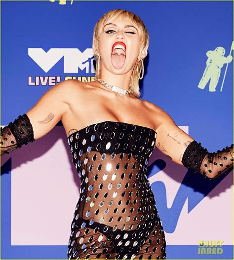 Miley Cyrus Wears Completely Sheer Dress For VMAs Red Carpet