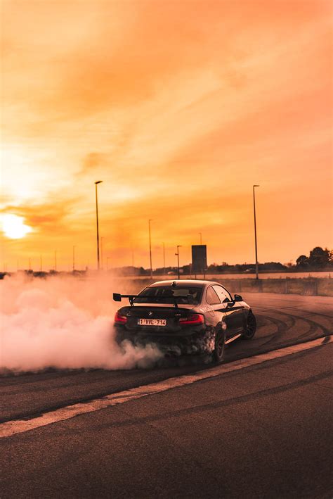 Black Car Drifting On Road During Day Automobile On Unsplash Night