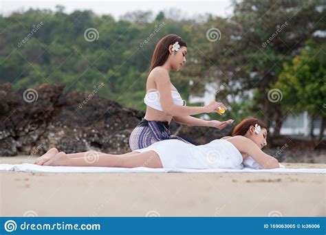 Beautiful Asian Woman Enjoying Spa Massage Therapy On The Beach Stock Image Image Of Dreaming