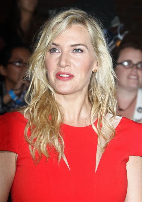 One enthusiastic fan, instead of asking kate winslet to take a selfie or sign his iphone with a sharpie. KATE WINSLET at Divergent Premiere in Los Angeles