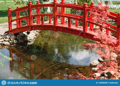Garden Decor Red Bridge Beautiful Pond In The Garden Stock Image