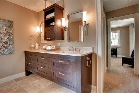 The wooden vanity allows the bright wall color to really pop. Custom Bathroom Cabinets MN | Custom Bathroom Vanity
