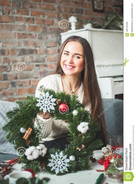Pretty Girl Florist Woman With Winter Christmas Garland Stock Photo