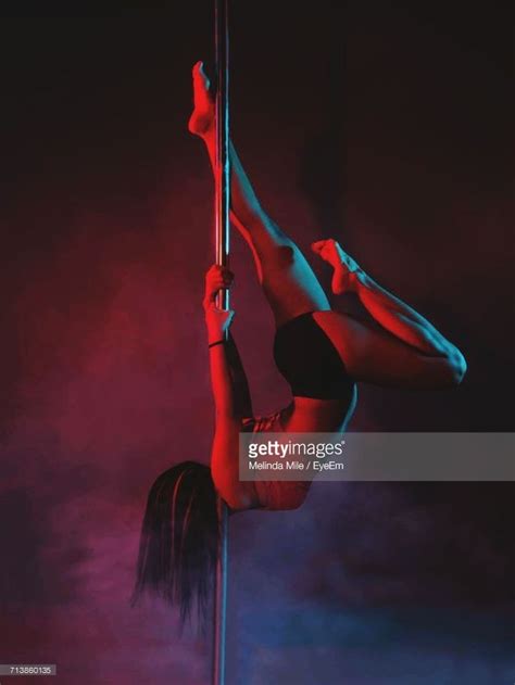 Sensuous Woman Performing Pole Dance At Nightclub Pole Dancing Pole