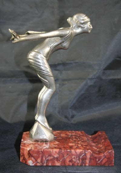 An Original Desmo Chromium Plated Bronze Car Mascot Speed Nymph Mounted On A Red Marble