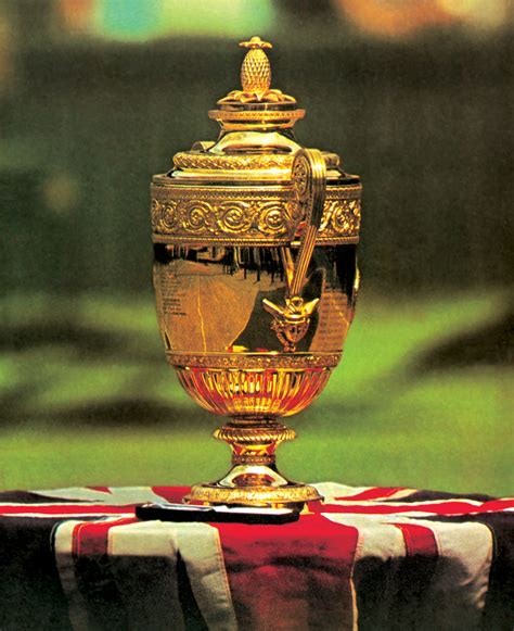 Pineapple sits atop the wimbledon cup as an outdated symbol of luxury. Wimbledon Championship Trophy Fruit