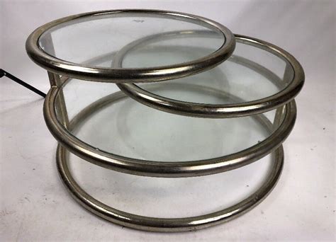 It can be used as a coffee table, round sofa table, end table, cocktail table, office table, etc. Mid-Century Milo Baughman style brass and glass coffee ...