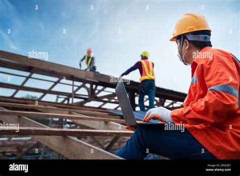 Engineer Technician Construction Worker Control Roofer Working On Roof