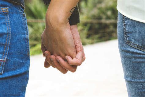 Man And Woman Holding Hands Stock Photo