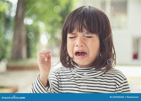Portrait Of Asian Crying Little Girl With Little Rolling Tears Weeping