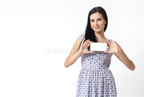 Portrait Of Beautiful Young Woman Holding Smartphone On White