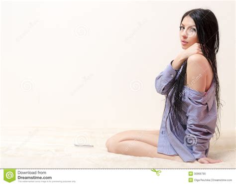 Young Woman In Mans Shirt Sitting On Sofa Alone Royalty Free Stock