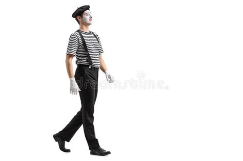 Full Length Profile Shot Of A Mime Walking Stock Image