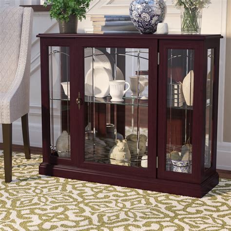 The amish mccoy mission curio cabinet with soft lighting and the shelves adjusted just so to showcase your cherished china or keepsakes. Purvoche Lighted Console Curio Cabinet & Reviews | Birch Lane