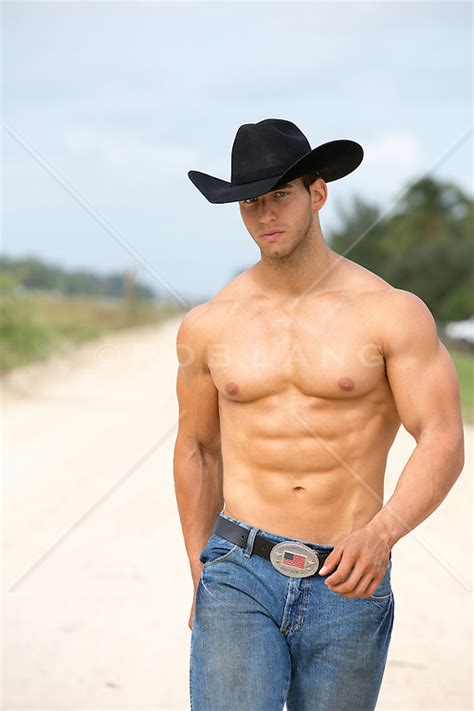 Hot Shirtless Cowboy Outdoors On A Dirt Road ROB LANG IMAGES